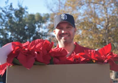 Elderhelp - Chris Morris with poinsettias