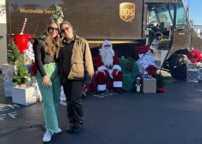 Elderhelp - Two ladies with Santa in front of UPS