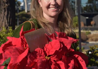 Elderhelp - Volunteer with Poinsettia